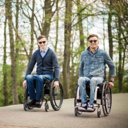 two people in wheelchairs with sunglasses